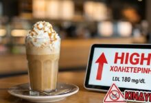 Ποτήρι με κρεμώδη καφέ latte και ζάχαρη που επιβαρύνει την καρδιά