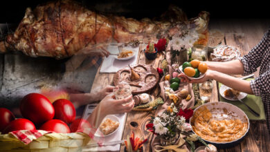 Παραδοσιακό πασχαλινό τραπέζι με αρνί στη σούβλα και κόκκινα αυγά.